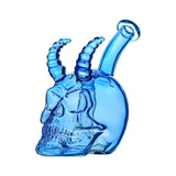 Handcrafted glass skull and horn dab rigs in yellow, red, blue, and pink translucent colors with a 14mm joint on a white background.