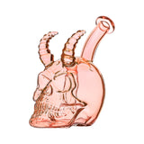 Handcrafted glass skull and horn dab rigs in yellow, red, blue, and pink translucent colors with a 14mm joint on a white background.