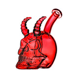 Handcrafted glass skull and horn dab rigs in yellow, red, blue, and pink translucent colors with a 14mm joint on a white background.