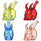 Handcrafted glass skull and horn dab rigs in yellow, red, blue, and pink translucent colors with a 14mm joint on a white background.